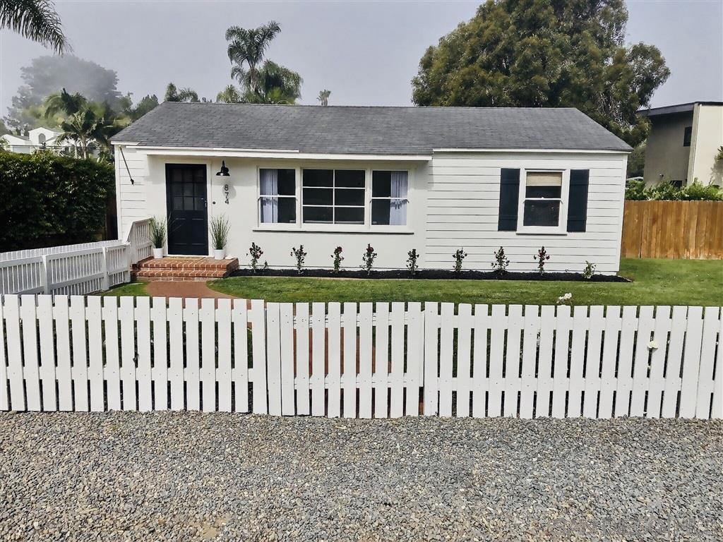 874 Arden Drive Encinitas, CA 92024 - Photo 3 of 25 a front view of a house with a garden