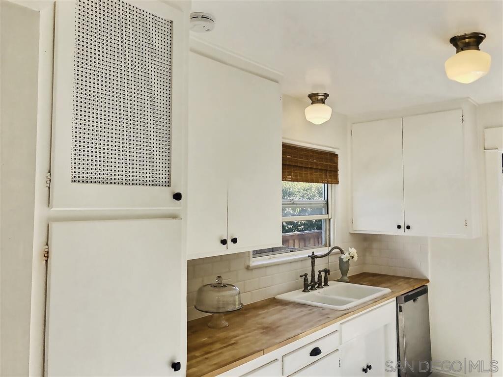 874 Arden Drive Encinitas, CA 92024 - Photo 9 of 25 a bathroom with a sink and a mirror