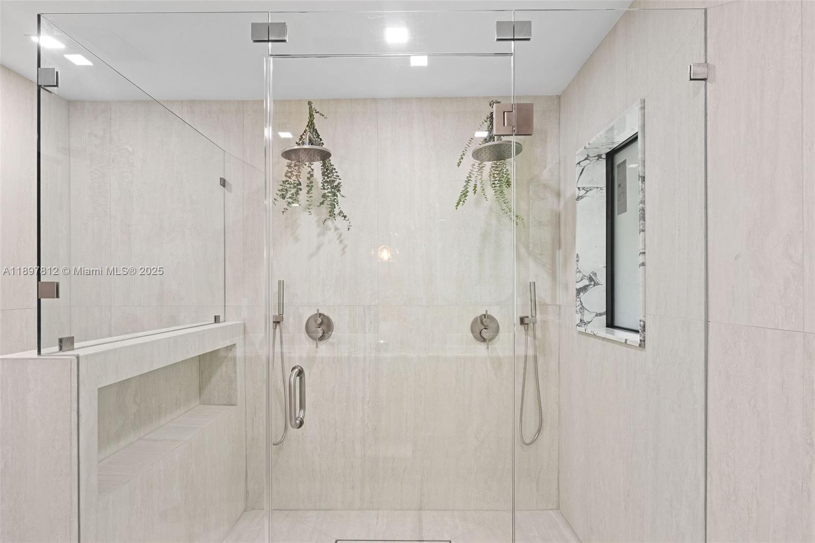 8858 Garland Avenue Surfside, FL 33154 - Photo 19 of 37 a bathroom with a shower