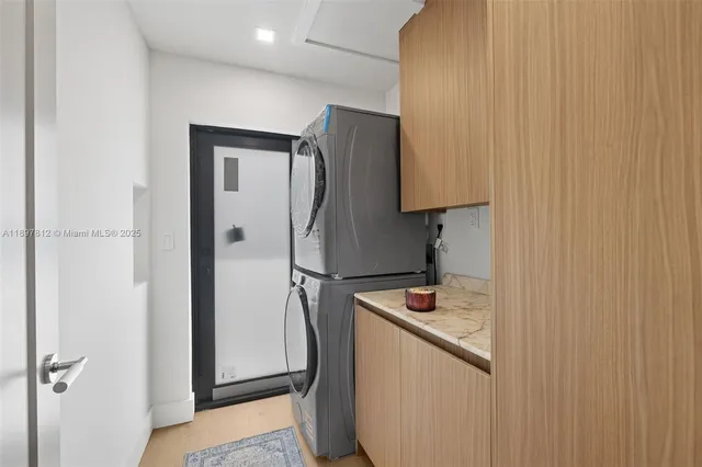 a white refrigerator freezer sitting inside of a kitchen