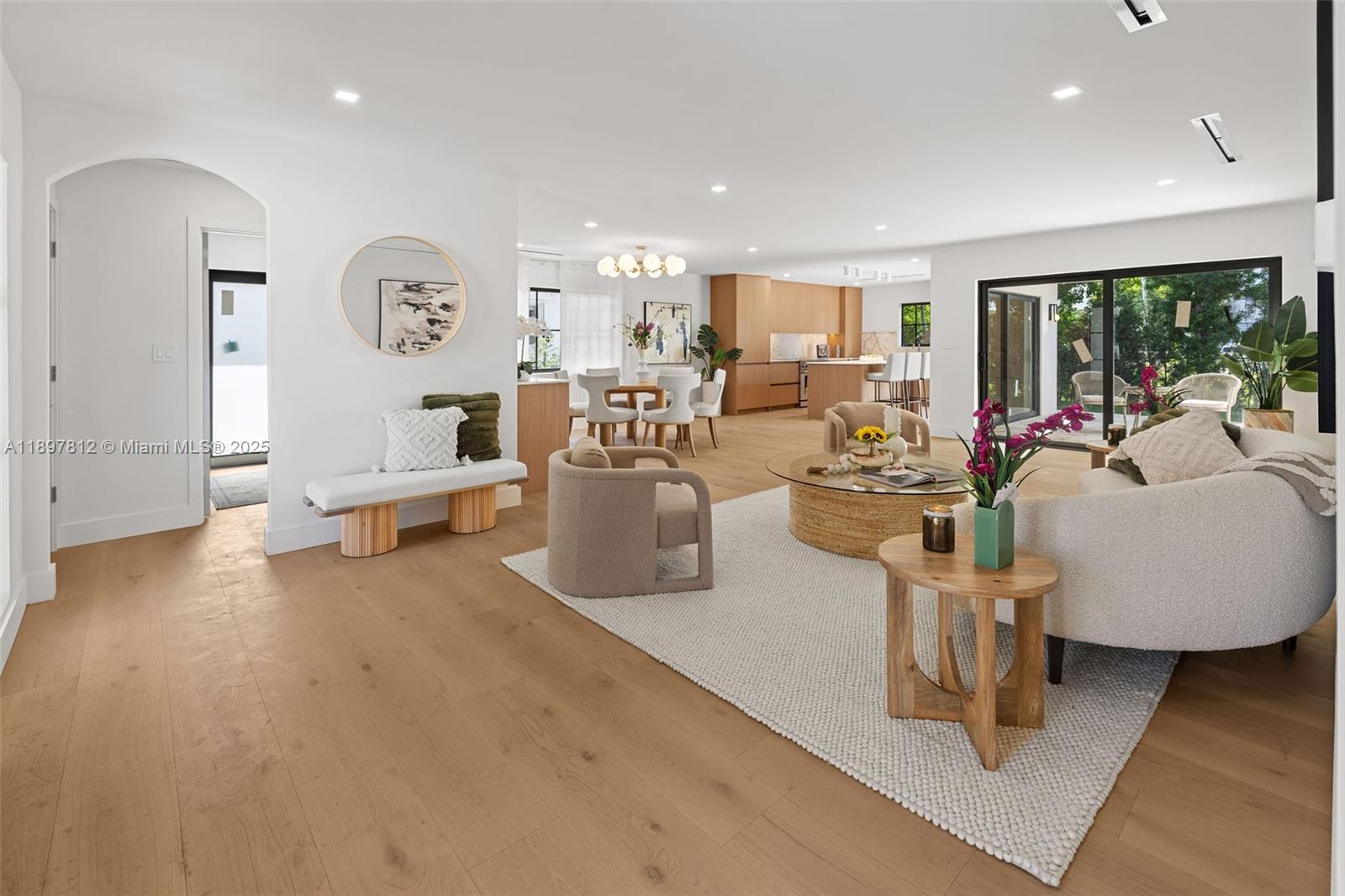8858 Garland Avenue Surfside, FL 33154 - Photo 7 of 37 a living room with furniture and a large window