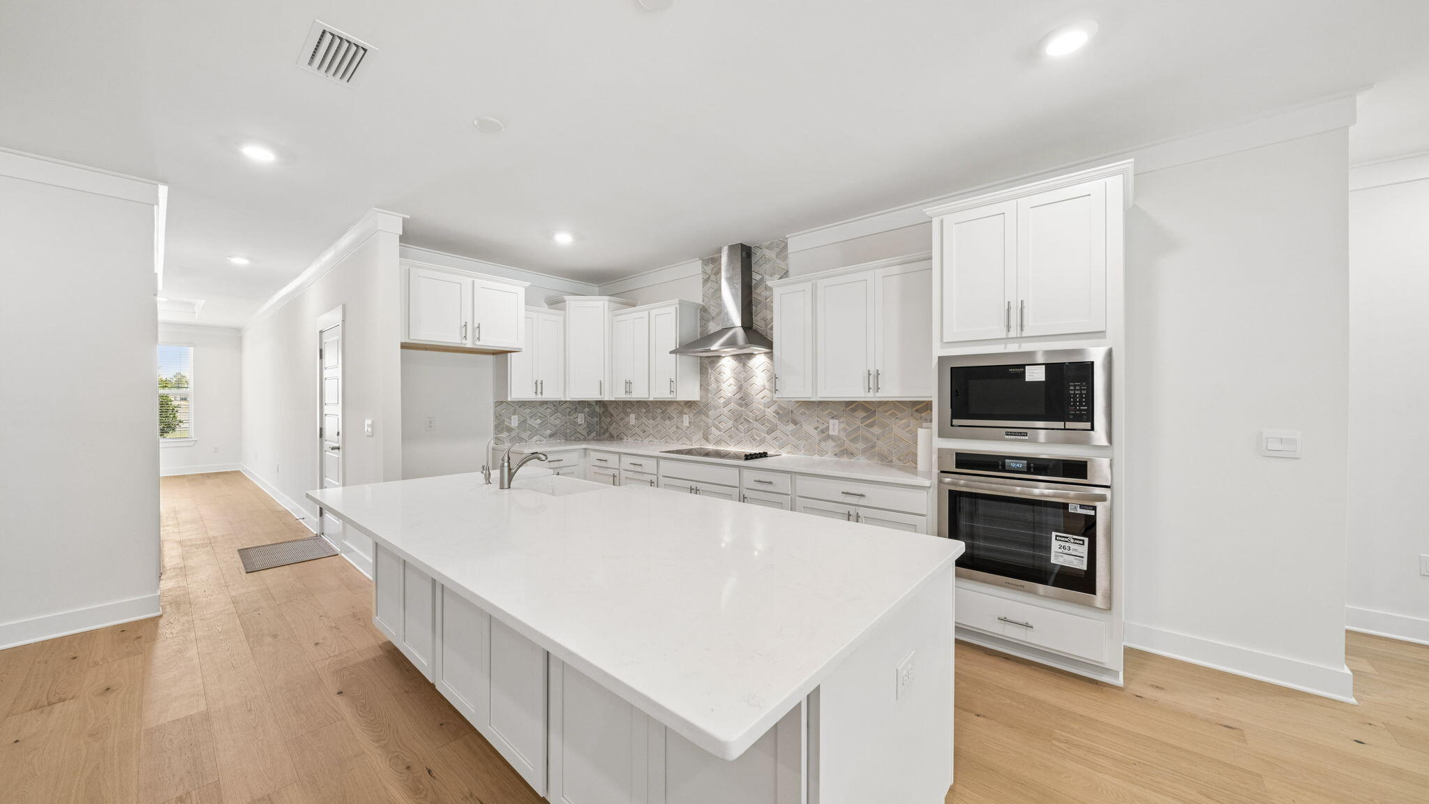 785 Old Ferry Road Santa Rosa Beach, FL 32459 - Photo 18 of 56 a kitchen with stainless steel appliances kitchen island sink refrigerator and cabinets