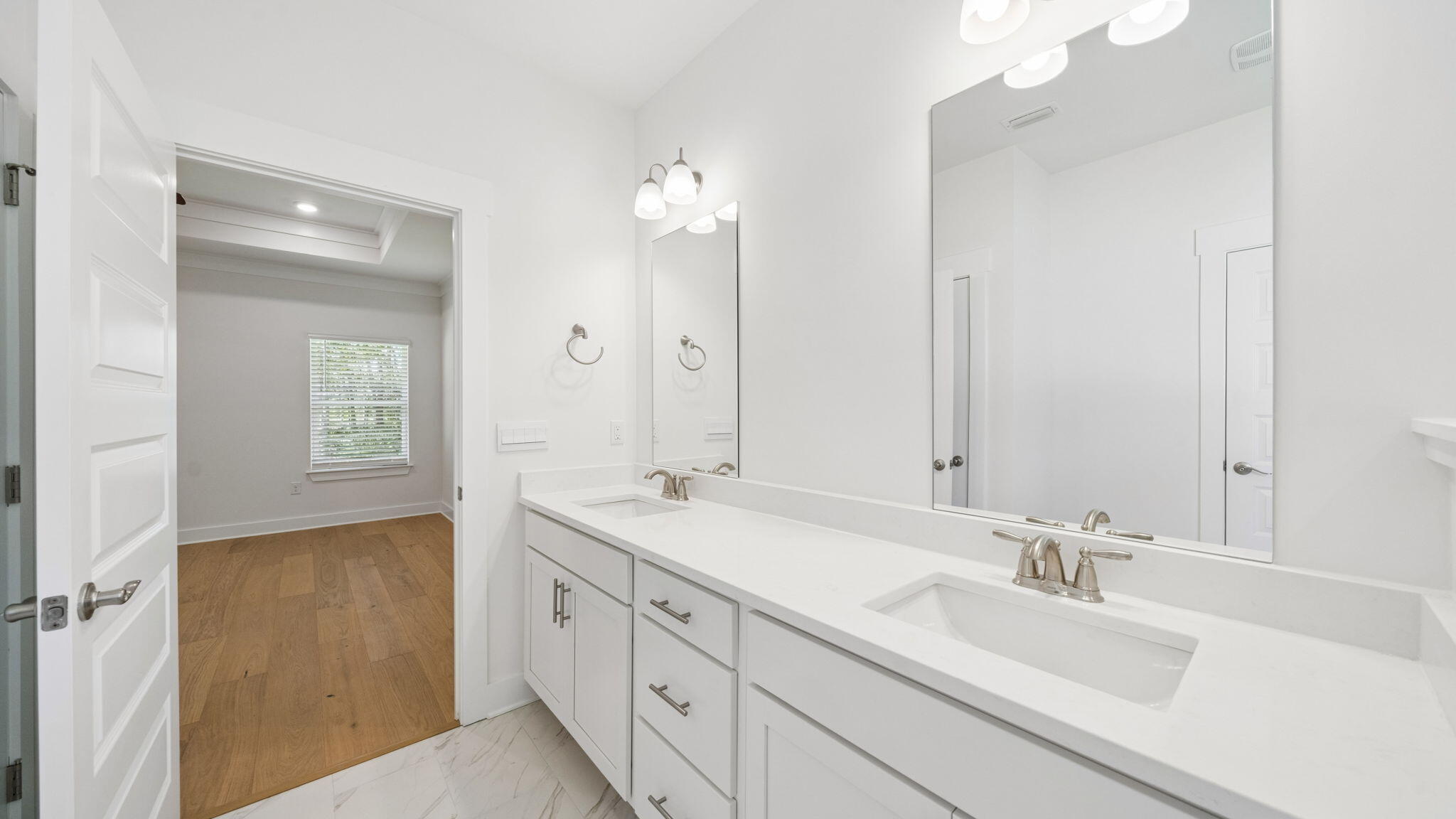 785 Old Ferry Road Santa Rosa Beach, FL 32459 - Photo 24 of 56 a bathroom with double sink and a mirror