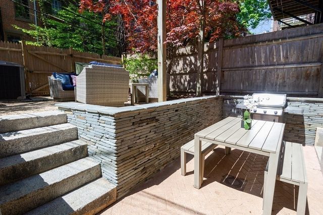 a view of backyard with seating space