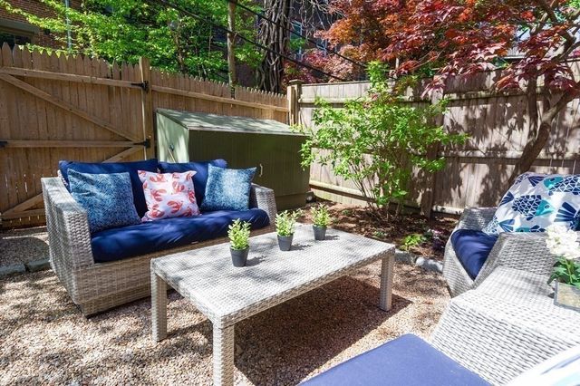 a view of outdoor sitting area with furniture