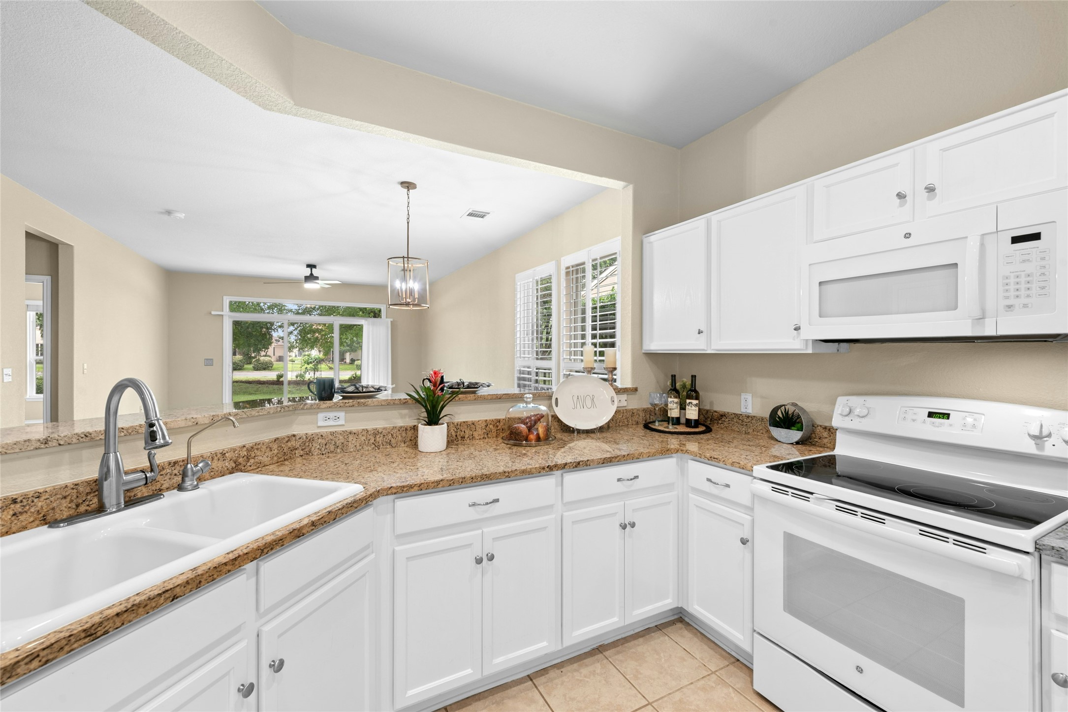 111 Hampton Circle Georgetown, TX 78633 - Photo 13 of 34 a kitchen with sink and cabinets
