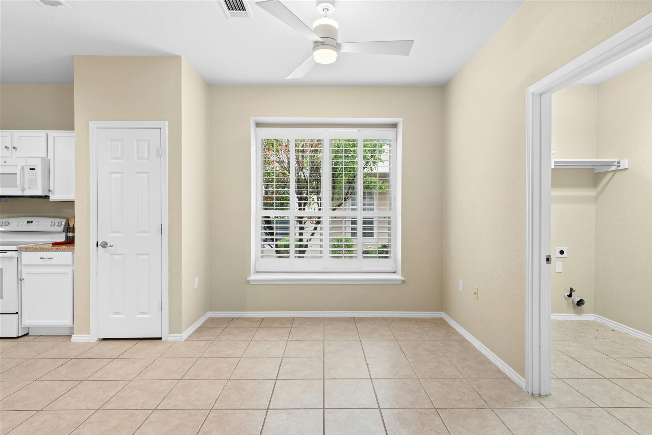 111 Hampton Circle Georgetown, TX 78633 - Photo 15 of 34 a view of an empty room with window and cabinet