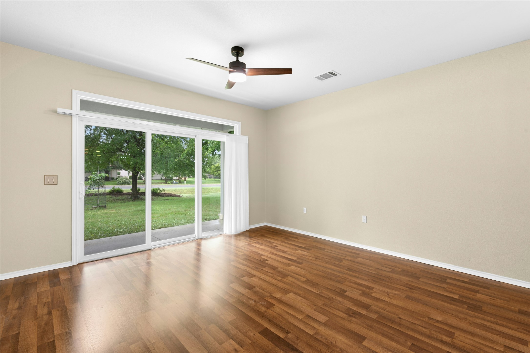 111 Hampton Circle Georgetown, TX 78633 - Photo 7 of 34 a view of a room with wooden floor and windows