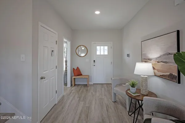 a bathroom with a sink a toilet a tub and shower
