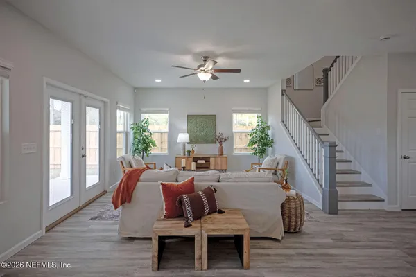 a bedroom with furniture and a window