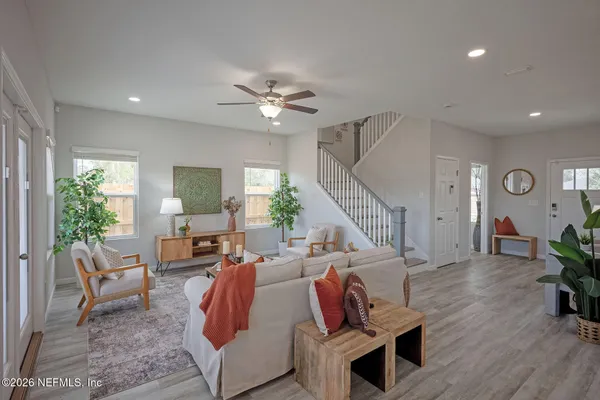 a living room with furniture and a window