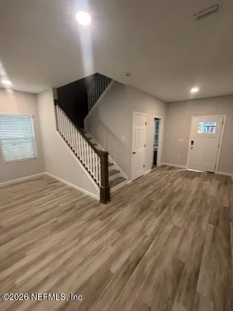 a bath tub sitting in a bathroom next to a window