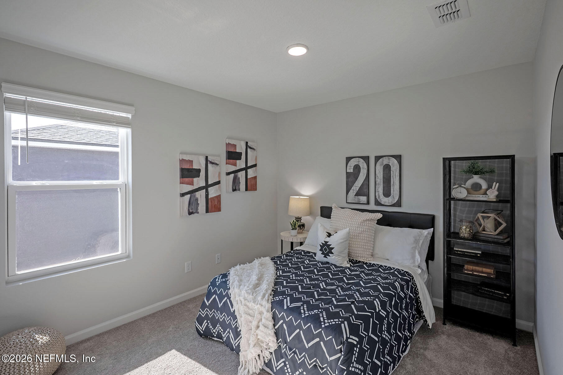 1223 Jewelstone Lane Jacksonville, FL 32221 - Photo 43 of 46 a bedroom with a bed and painting on the wall