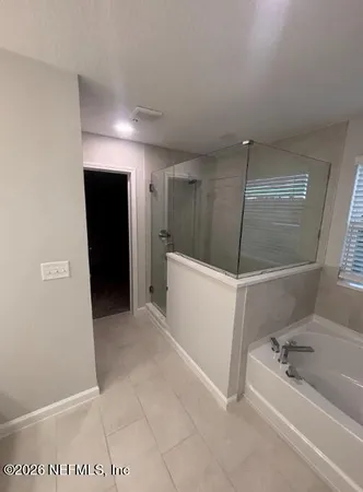 a bathroom with a granite countertop sink toilet a shower and a bathtub