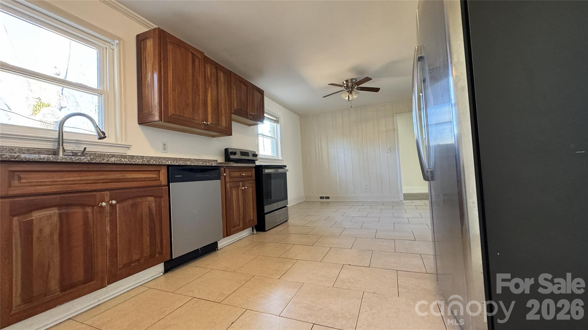 7507 Wilson Grove Road Mint Hill, NC 28227 - Photo 14 of 48 a kitchen with stainless steel appliances granite countertop a stove a sink and a refrigerator