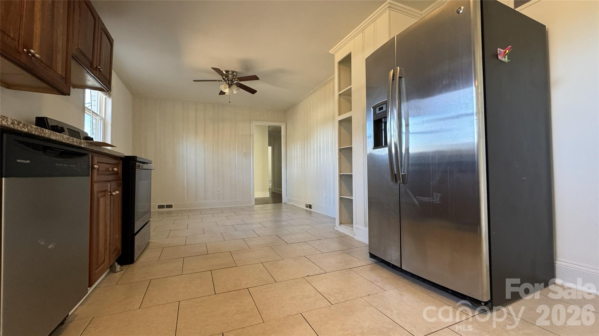 7507 Wilson Grove Road Mint Hill, NC 28227 - Photo 15 of 48 a view of a refrigerator in kitchen and an empty room