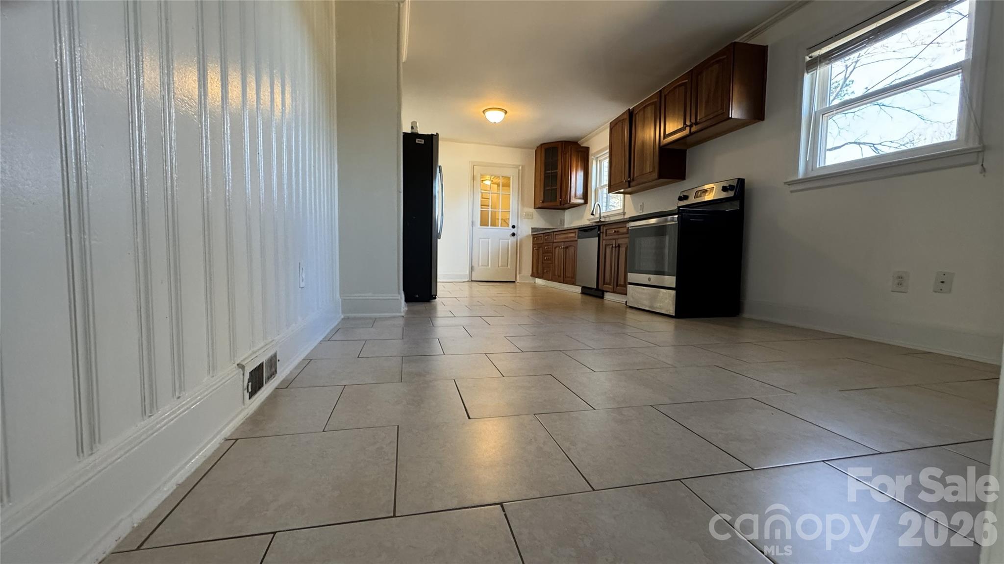7507 Wilson Grove Road Mint Hill, NC 28227 - Photo 16 of 48 a kitchen with stainless steel appliances granite countertop a refrigerator and a stove top oven
