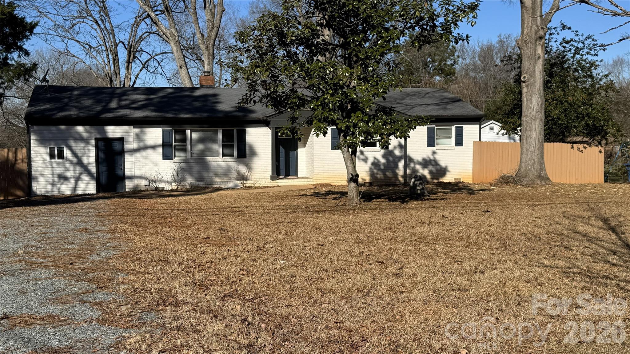 7507 Wilson Grove Road Mint Hill, NC 28227 - Photo 2 of 48 a view of a house with a large tree
