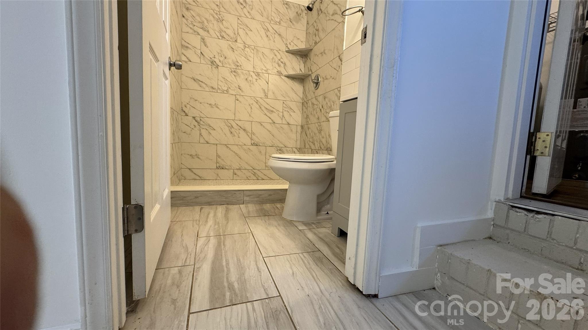 7507 Wilson Grove Road Mint Hill, NC 28227 - Photo 23 of 48 a bathroom with a sink and a toilet