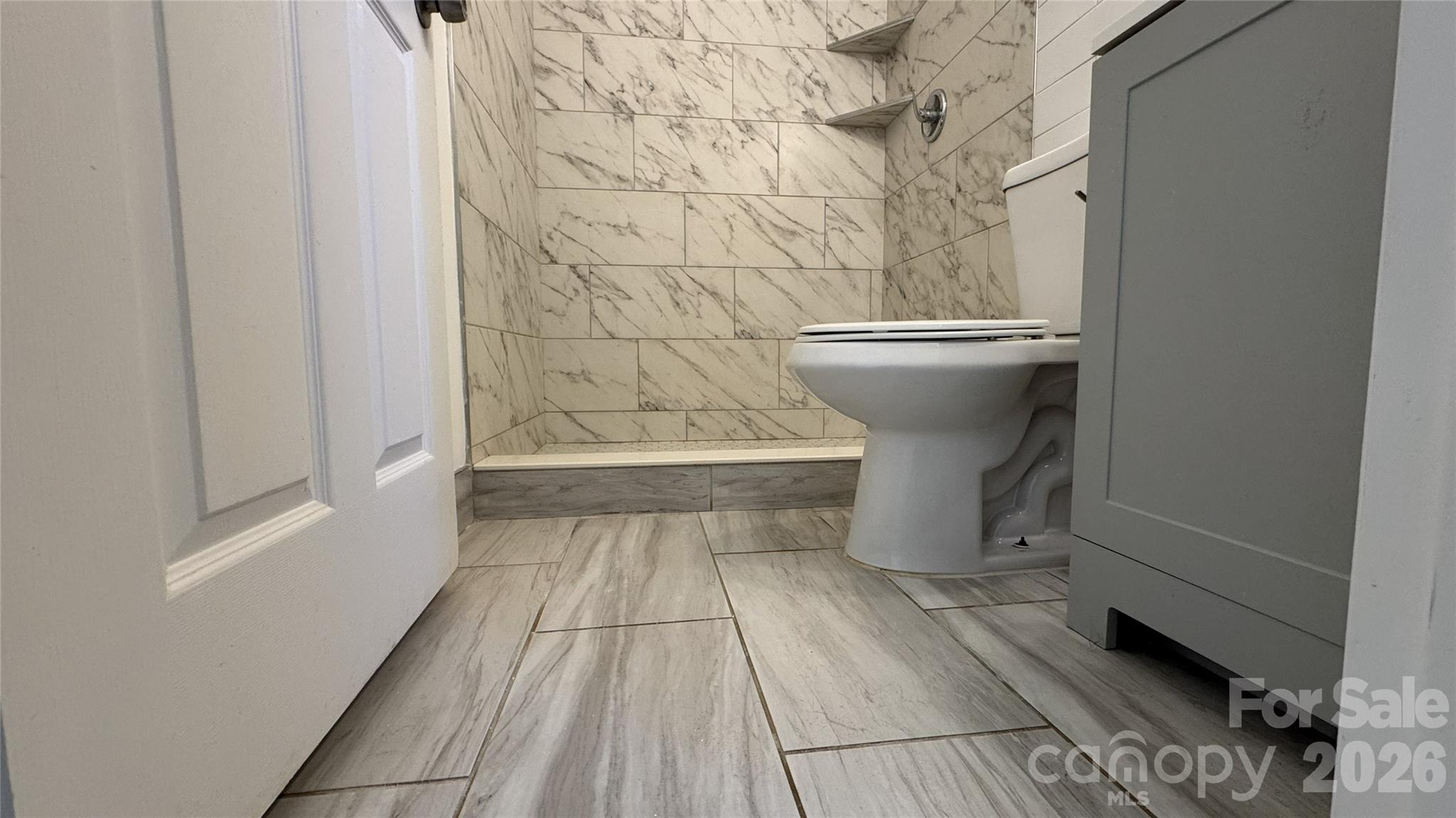 7507 Wilson Grove Road Mint Hill, NC 28227 - Photo 24 of 48 a bathroom with a toilet and a sink