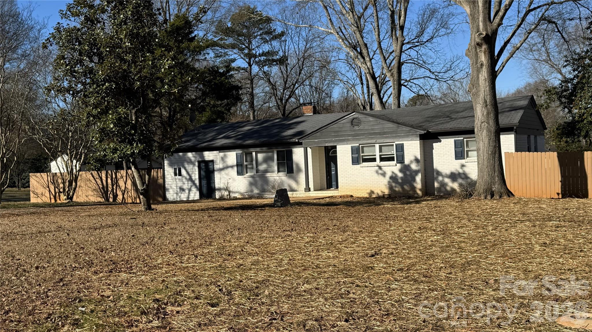 7507 Wilson Grove Road Mint Hill, NC 28227 - Photo 3 of 48 a front view of a house with a yard