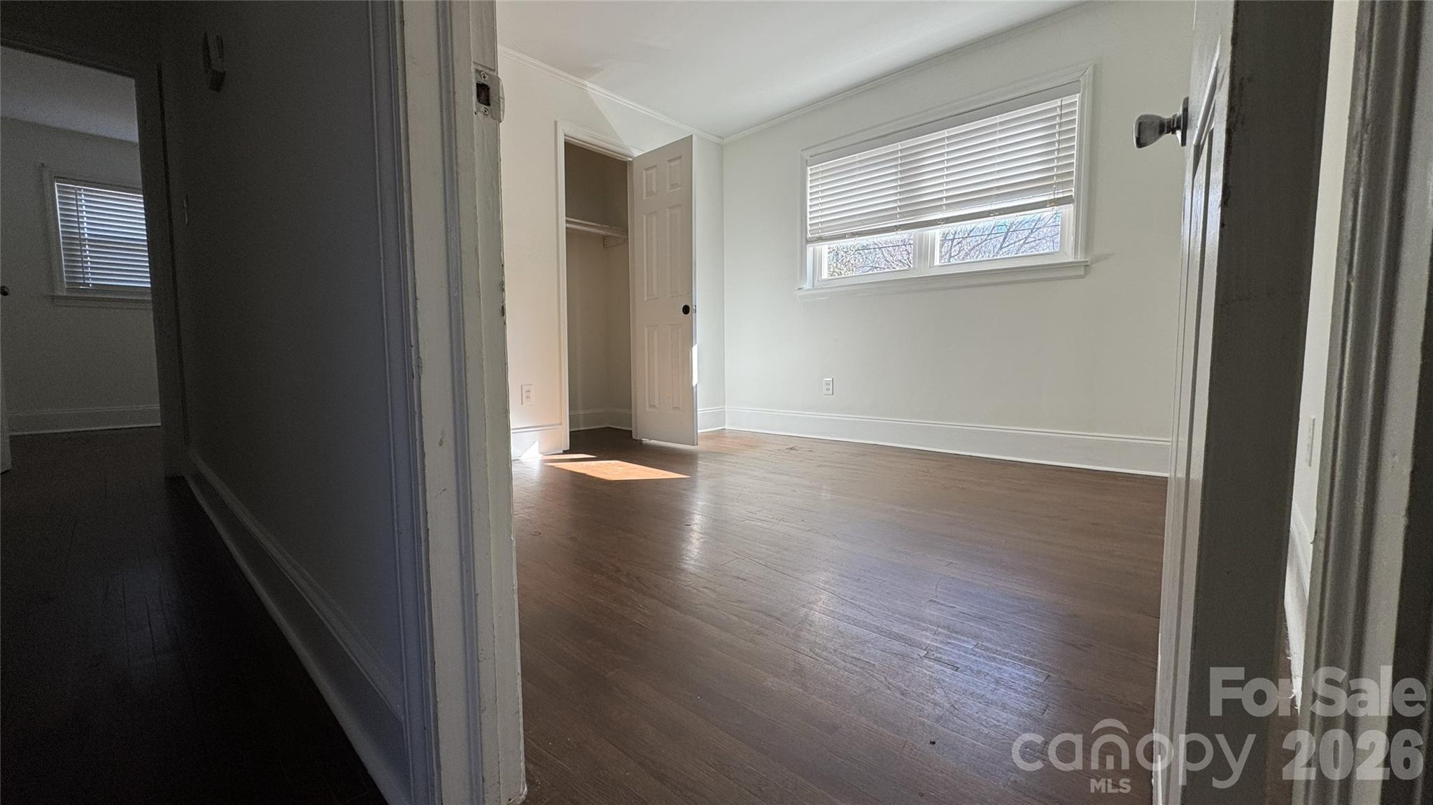 7507 Wilson Grove Road Mint Hill, NC 28227 - Photo 31 of 48 a view of a hallway with wooden floor