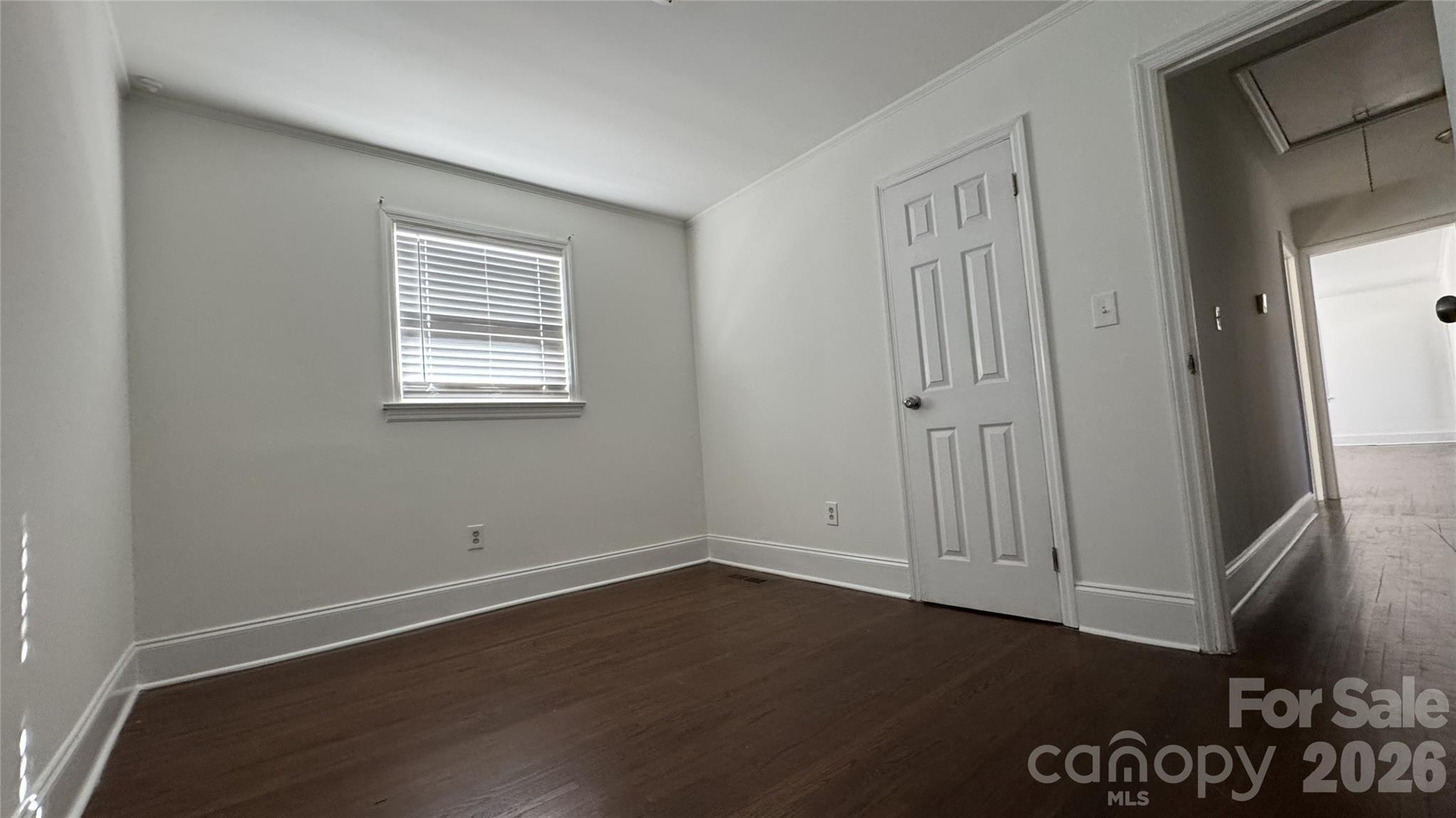 7507 Wilson Grove Road Mint Hill, NC 28227 - Photo 39 of 48 an empty room with wooden floor and windows