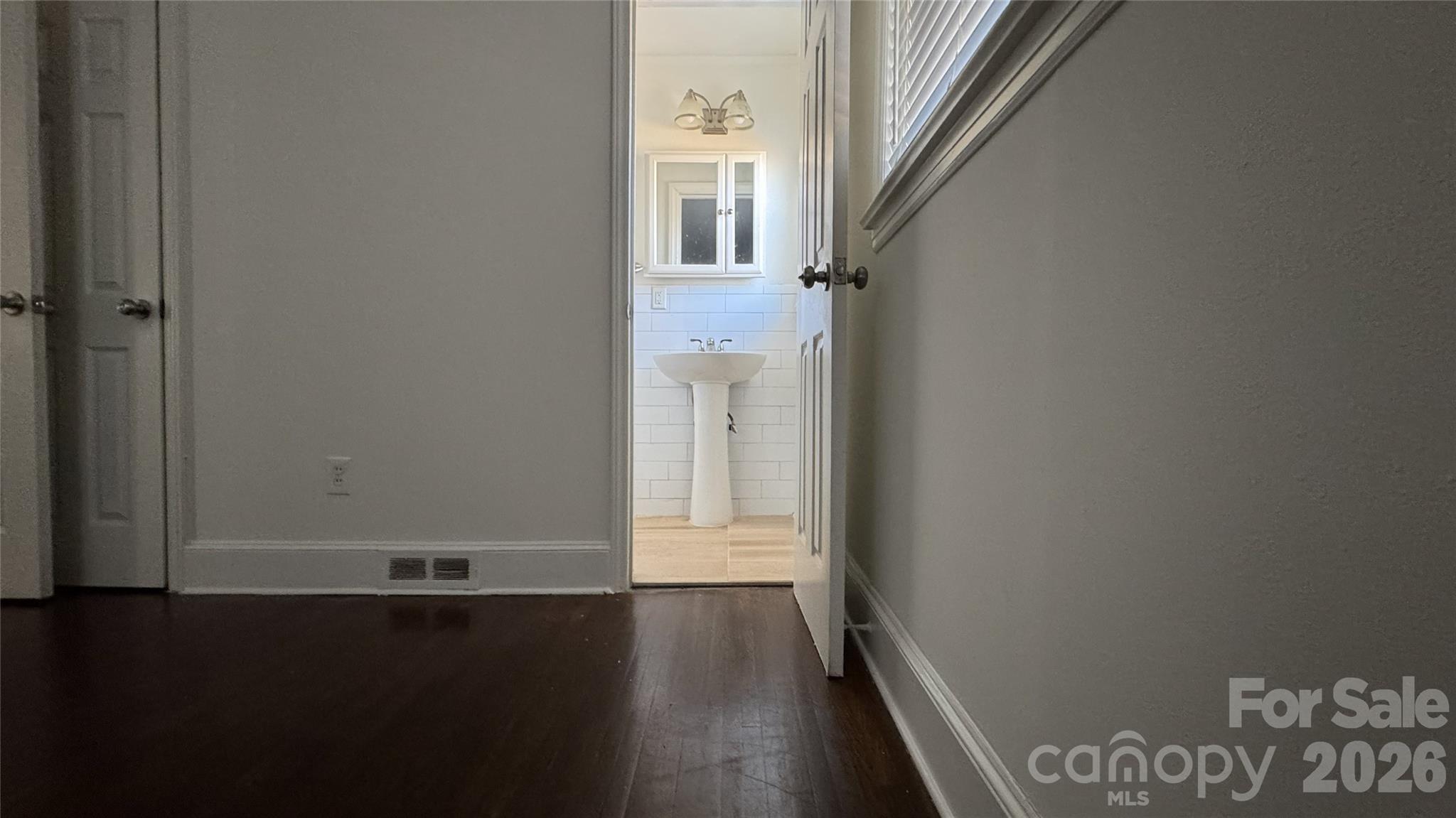 7507 Wilson Grove Road Mint Hill, NC 28227 - Photo 43 of 48 a view of a hallway with wooden floor and entryway