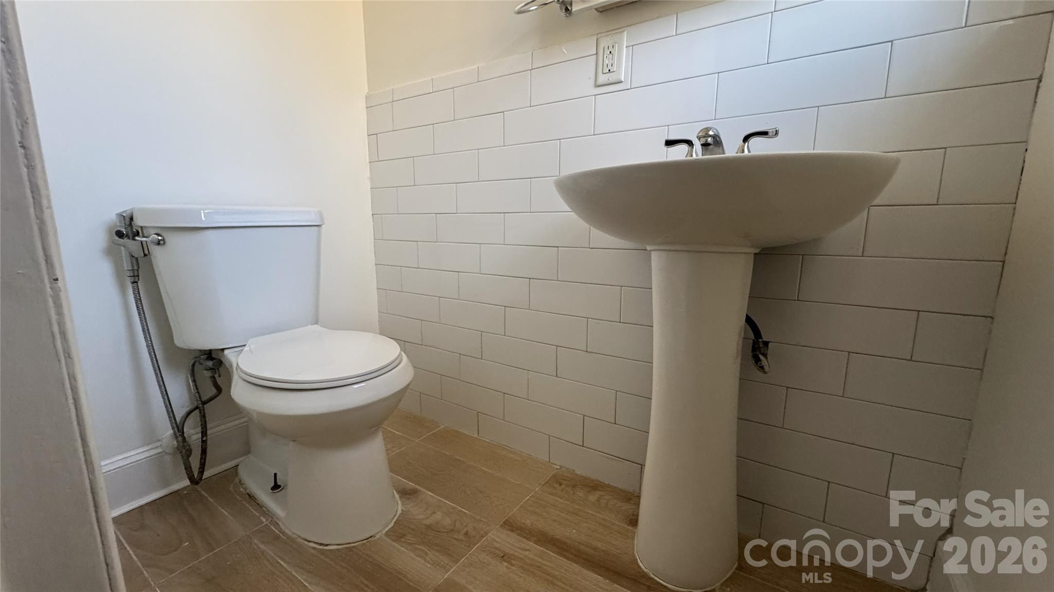 7507 Wilson Grove Road Mint Hill, NC 28227 - Photo 44 of 48 a white toilet sitting next to a bathroom sink