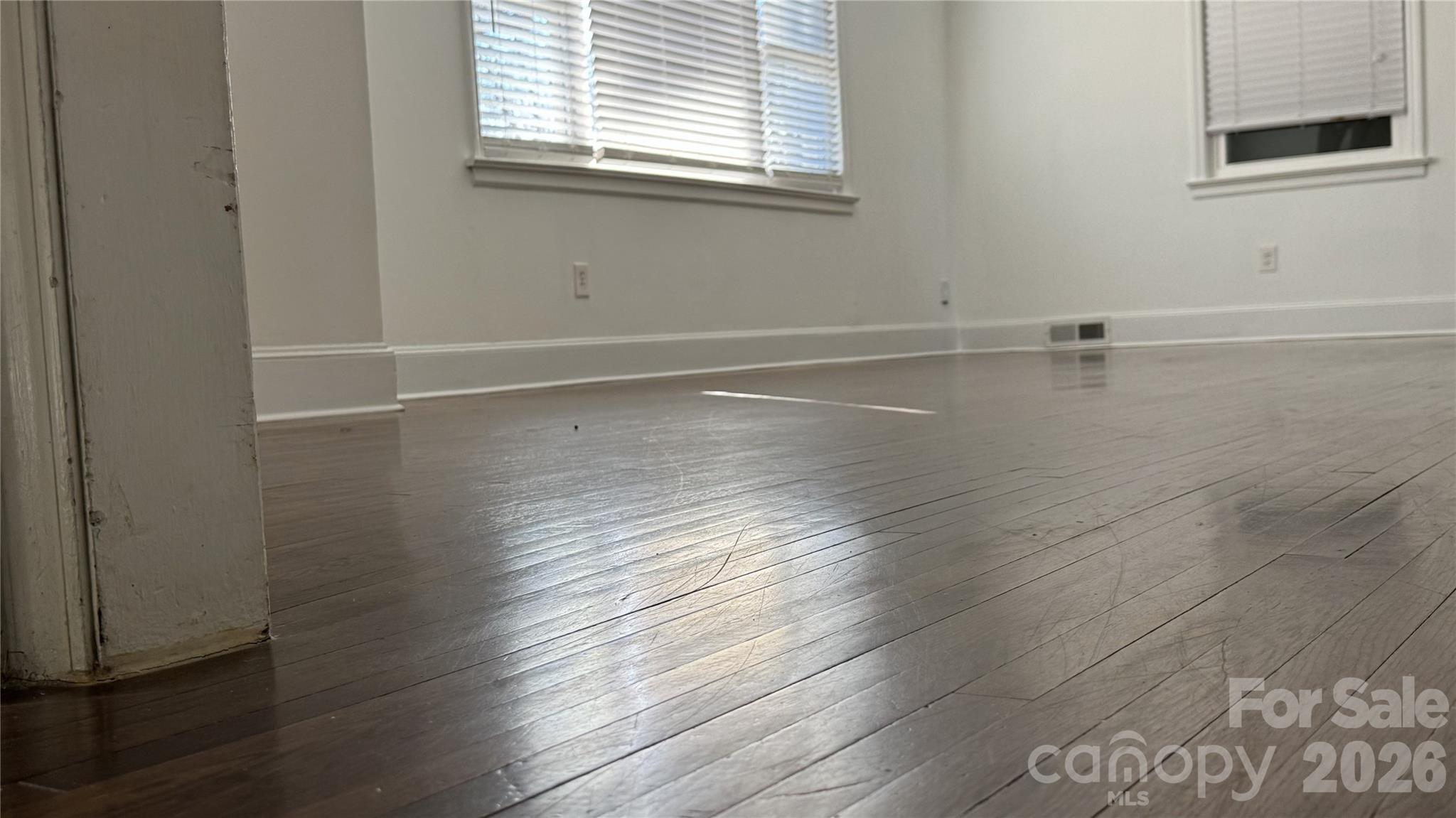 7507 Wilson Grove Road Mint Hill, NC 28227 - Photo 46 of 48 a view of an empty room with wooden floor and a window