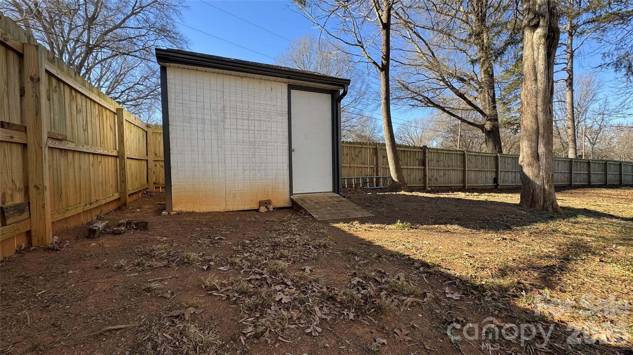 7507 Wilson Grove Road Mint Hill, NC 28227 - Photo 6 of 48 a view of a house with a yard covered in snow