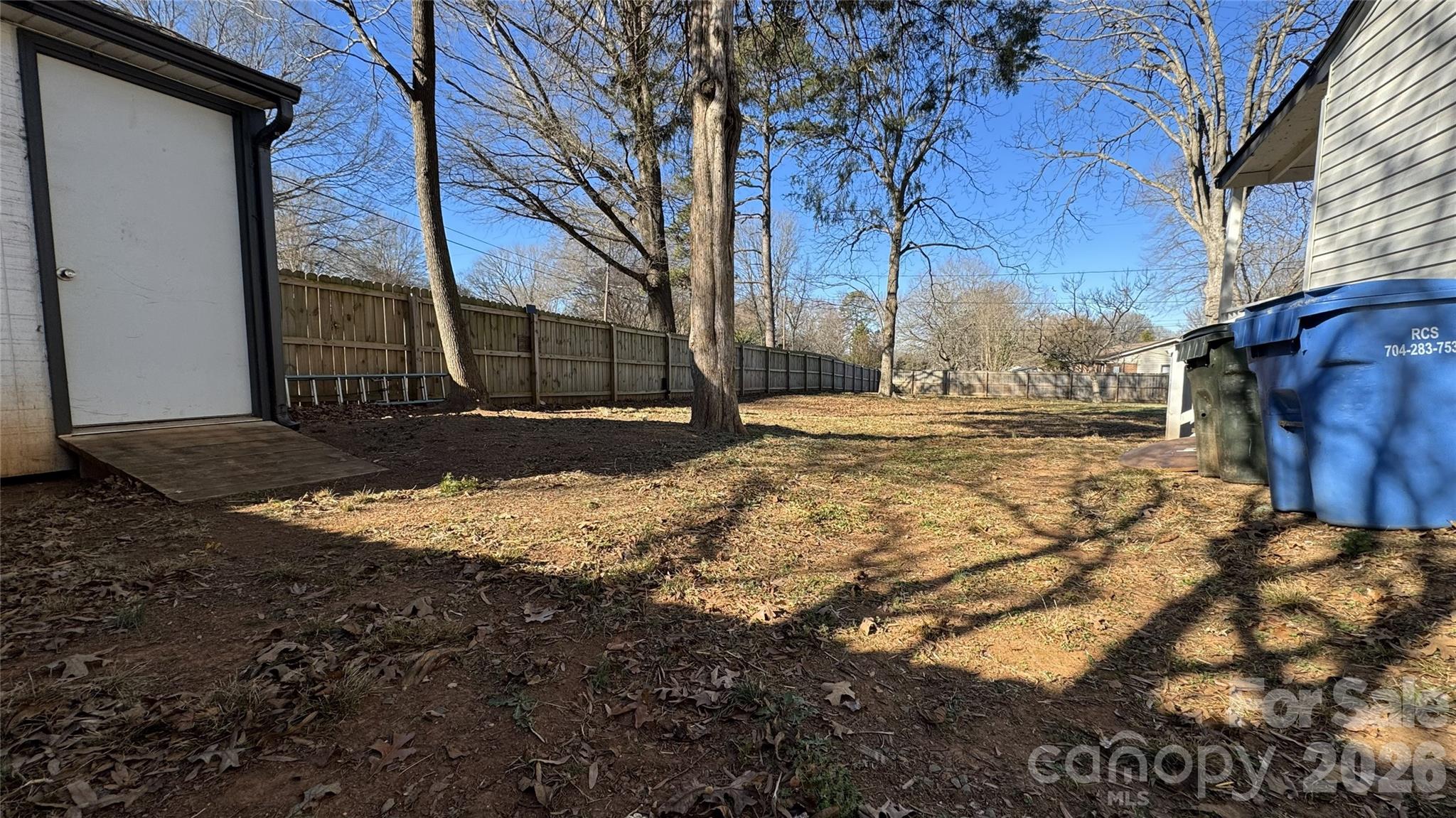 7507 Wilson Grove Road Mint Hill, NC 28227 - Photo 7 of 48 a view of a yard with a large tree