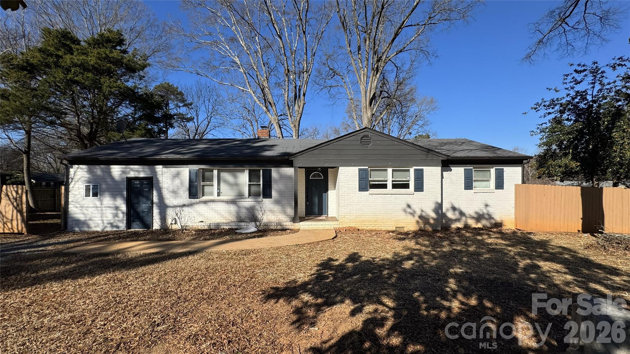 7507 Wilson Grove Road Mint Hill, NC 28227 - Photo 10 of 48 a front view of a house with a yard