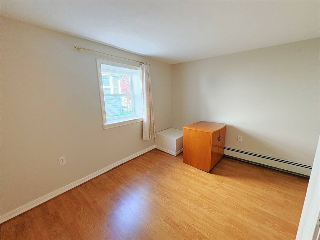 55 Sutherland Road, Unit 55 Arlington, MA 02476 - Photo 20 of 23 an empty room with a window