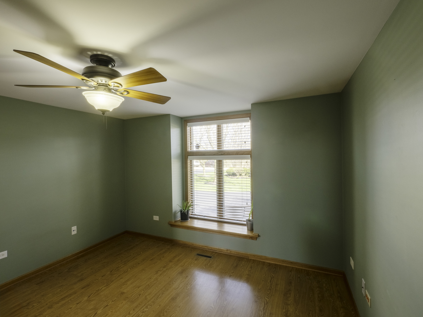 13310 Derby Road Lemont, IL 60439 - Photo 16 of 48 a view of an empty room with window and chandelier fan