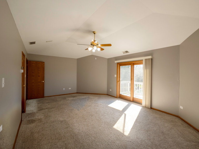 13310 Derby Road Lemont, IL 60439 - Photo 22 of 48 a view of a livingroom with a ceiling fan and window