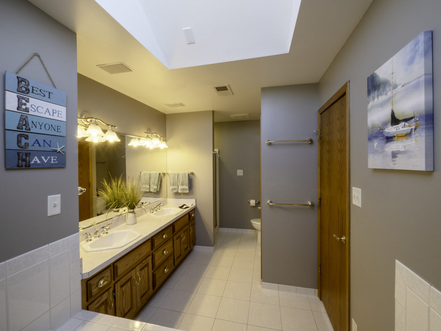 13310 Derby Road Lemont, IL 60439 - Photo 24 of 48 a spacious bathroom with a double vanity sink a large mirror and a shower