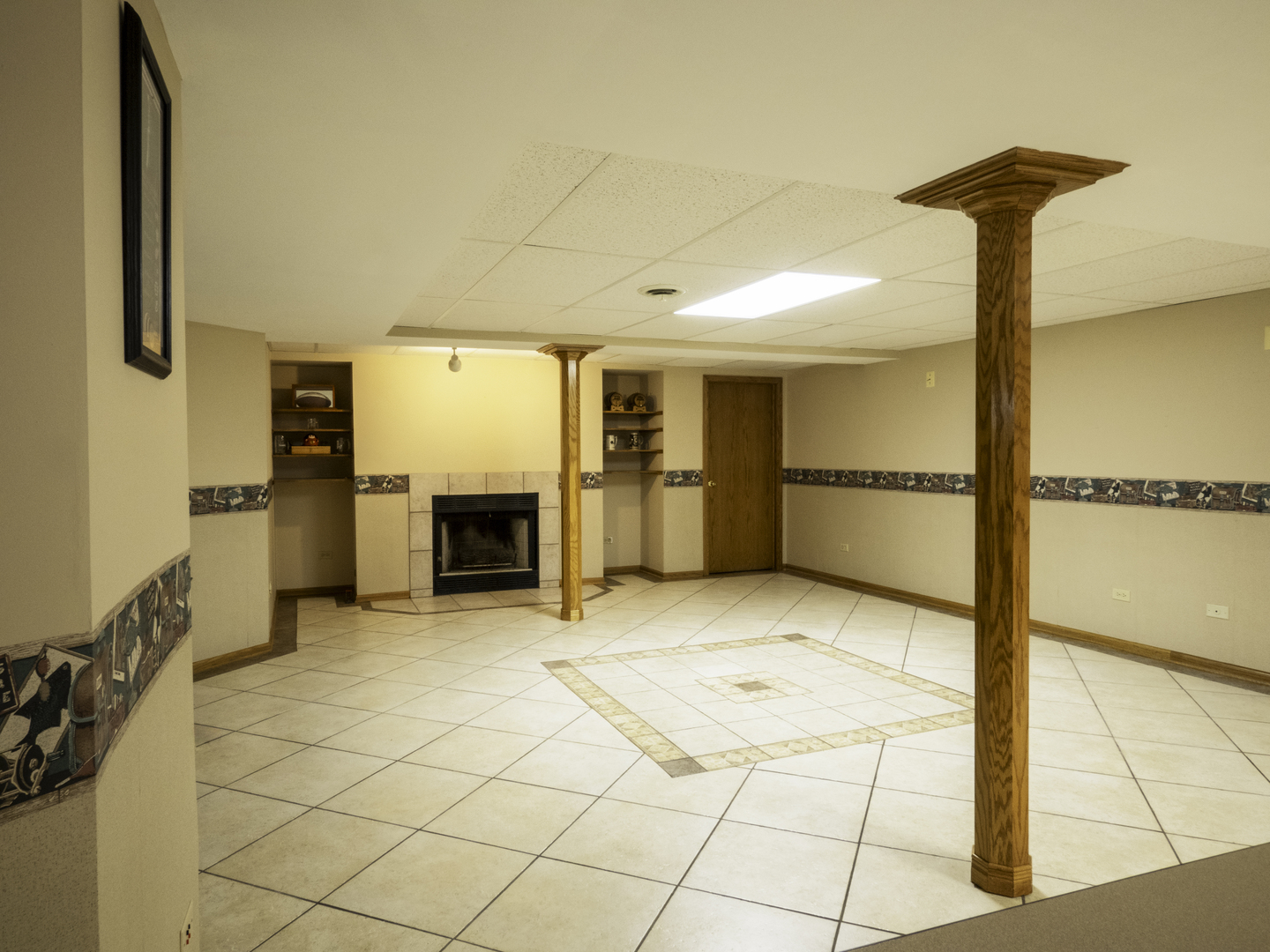 13310 Derby Road Lemont, IL 60439 - Photo 34 of 48 a view of a livingroom with a fireplace and a chandelier