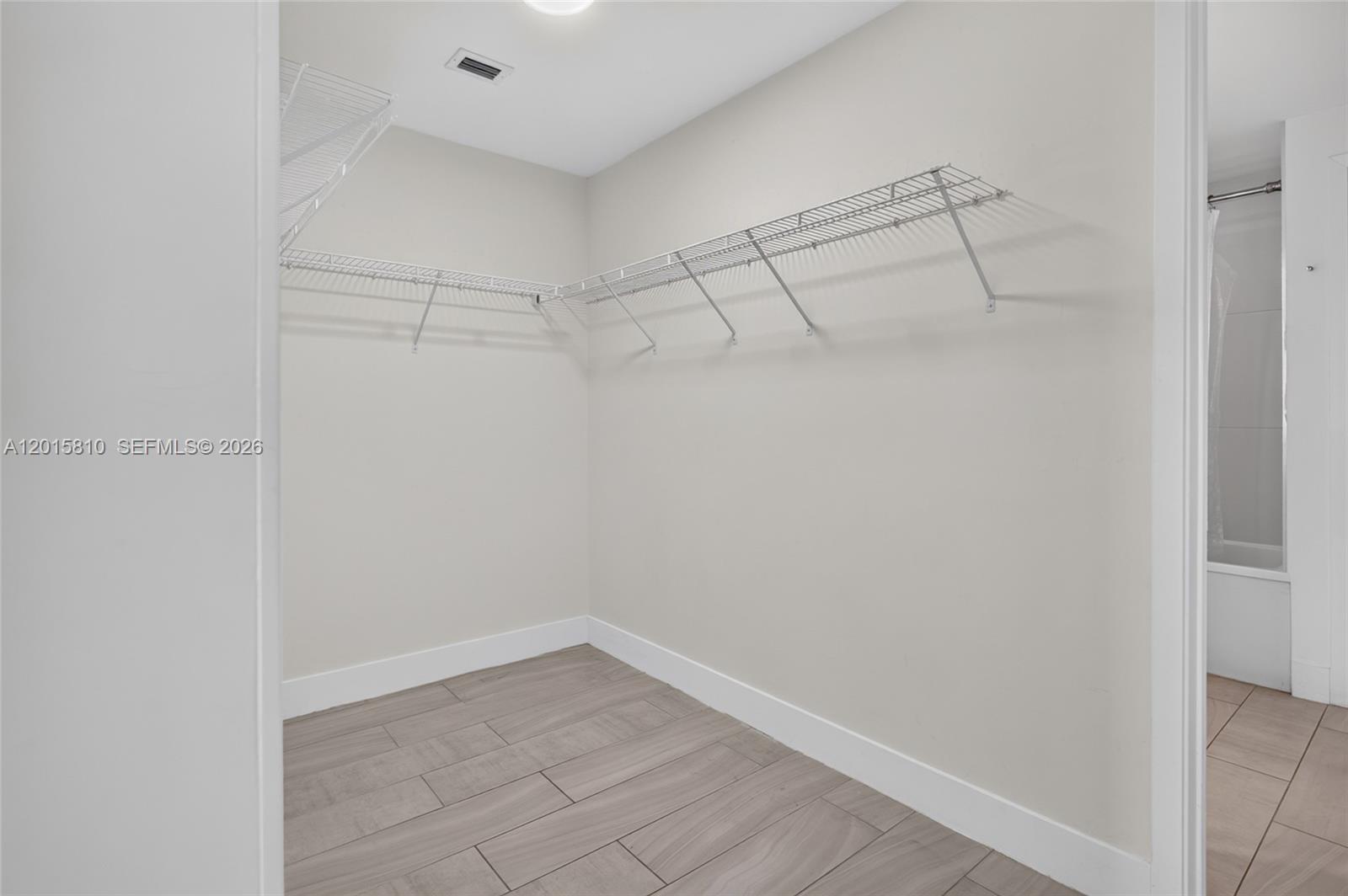 2000 Metropica Way, Unit 1902 Sunrise, FL 33323 - Photo 21 of 40 a view of a room with racks on the wall