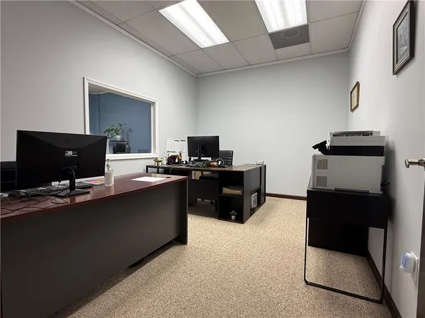 a kitchen with a sink cabinets and appliances