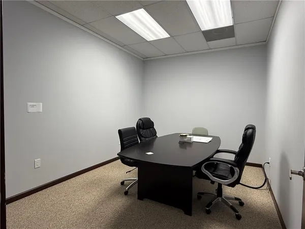 a workspace with furniture and a table