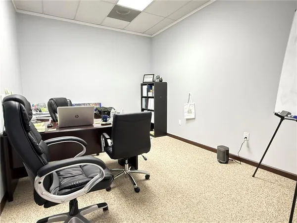 a view of workspace with lounge chair