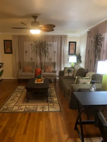 a kitchen with kitchen island granite countertop a sink and cabinets
