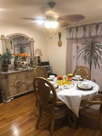 a living room with furniture rug and a floor to ceiling window