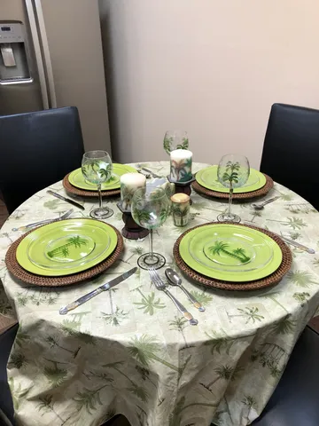 a bathroom with a toilet sink and shower curtain