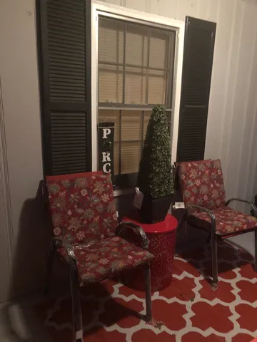 a view of a room with a table and a chair