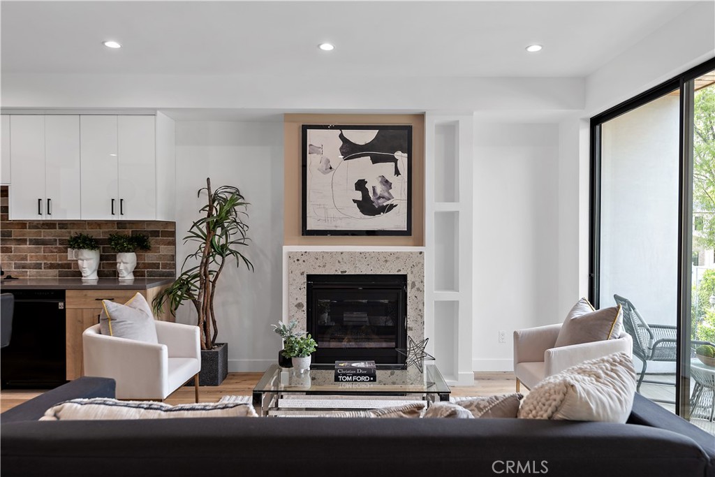 11857 West Flower Ln Valley Village Valley Village, CA 91607 - Photo 15 of 54 a living room with furniture a fireplace and a potted plant