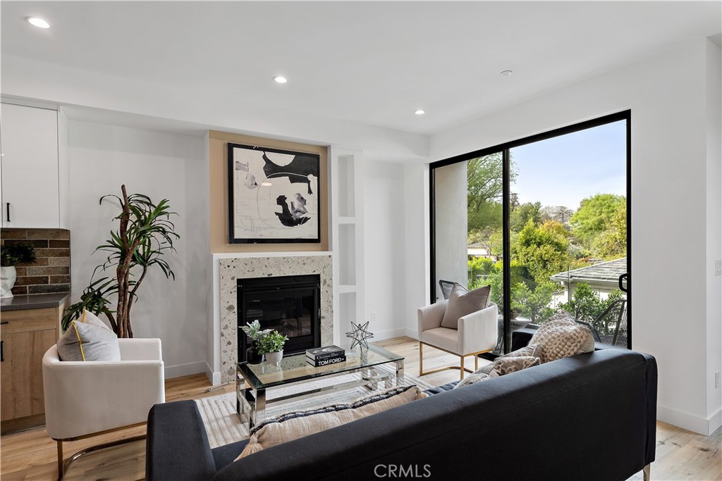 11857 West Flower Ln Valley Village Valley Village, CA 91607 - Photo 17 of 54 a living room with furniture and a fireplace