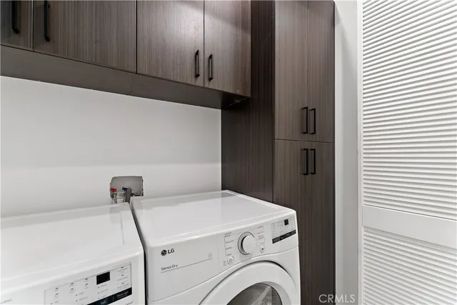 a view of a hallway with dining area and glass door