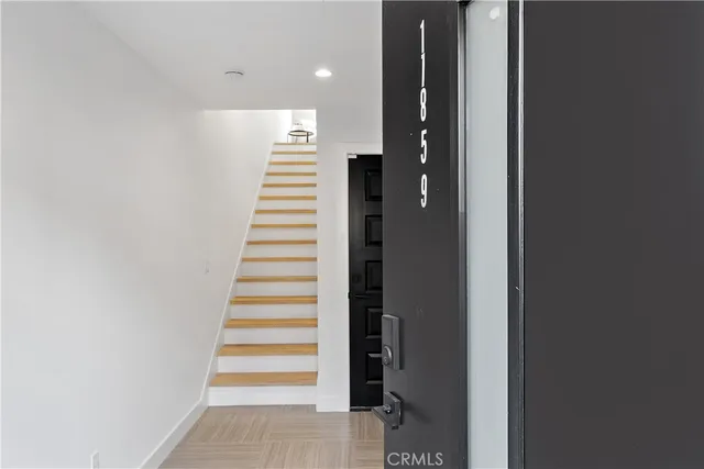 a view of a livingroom with furniture and workspace